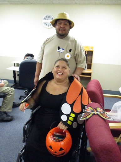 Rosalie and her husband are handing out candy at the Make it Take it